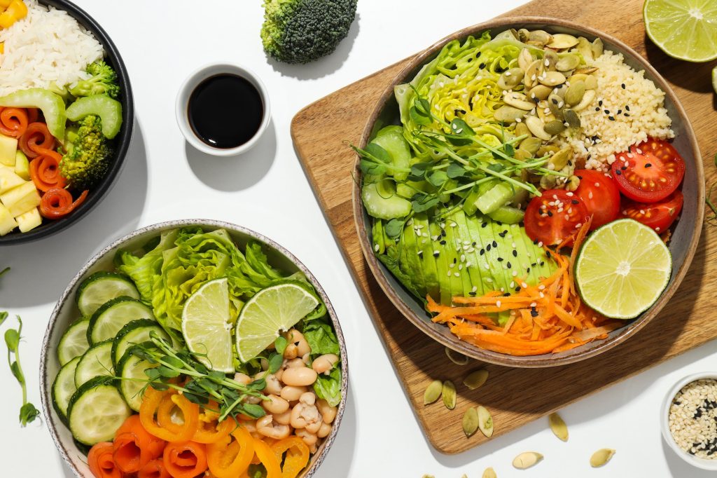 Bowls with tasty and nutritious food, top view