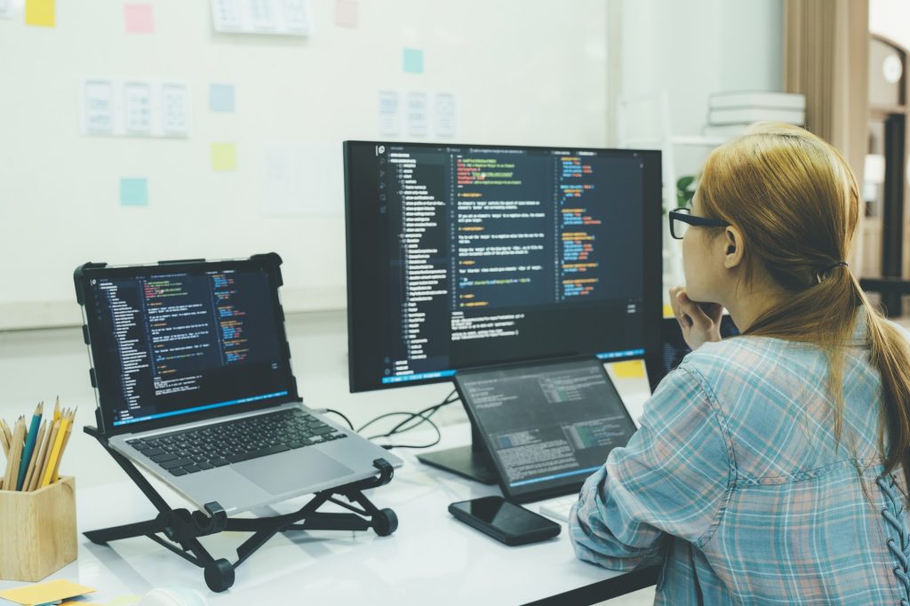 Programmer is coding and programming software.
